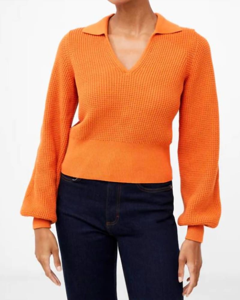 Front of a model wearing a size Large Mozart V-Neck Collar Sweater in Burnt Orange in Burnt Orange by French Connection. | dia_product_style_image_id:346901